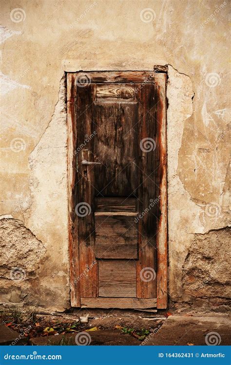 Old Broken Wooden Brown Door With Handle High Over Ground Stock Image