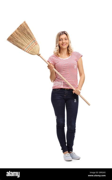 Blond Woman Posing With A Broom Isolated On White Background Stock