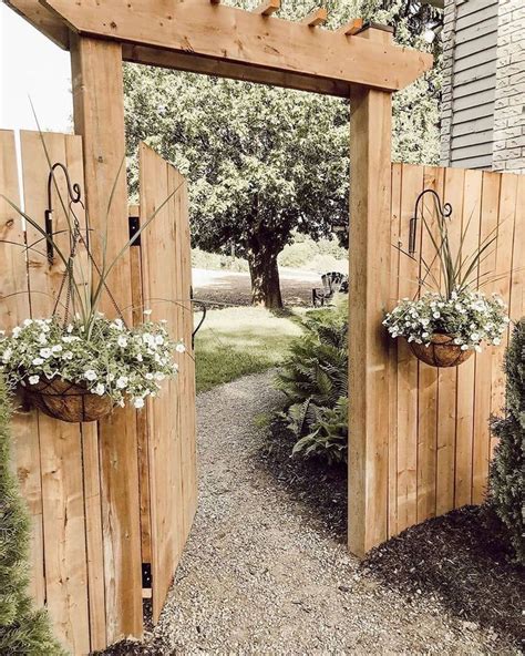 Two Wooden Gates With Flower Pots On Them
