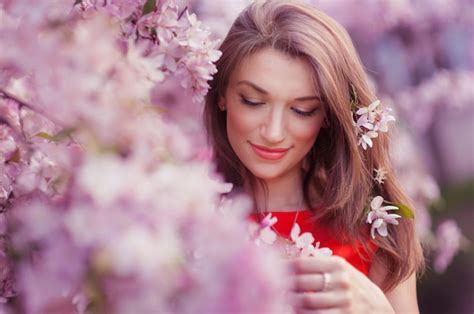 Premium Photo Beautiful Woman Near The Blossoming Spring Tree