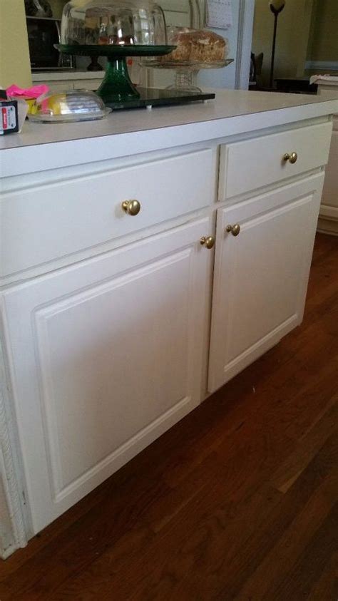 Once the vinyl has been cut, you should be able to slowly start peeling the vinyl back. Redoing My Kitchen Peeling Cabinets One at a Time | Hometalk