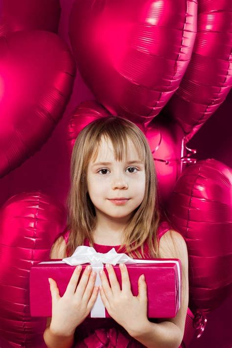 Little Girl With T And Pink Balloons On Colorful Pink Background