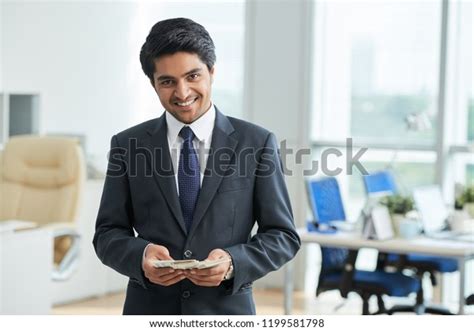 Portrait Indian Young Manager Holding Salary Stock Photo 1199581798