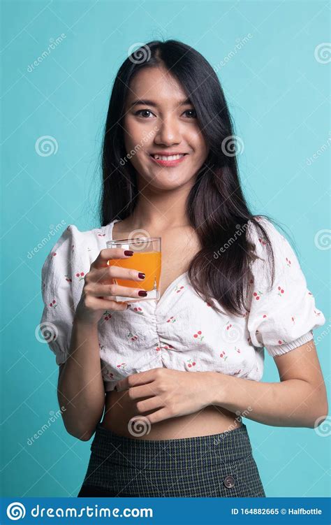 Young Asian Woman Drink Orange Juice Stock Image Image Of Orange Healthy 164882665