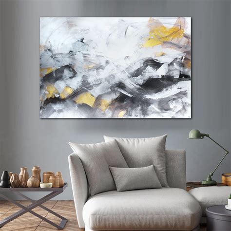 An Abstract Painting Hangs On The Wall In A Living Room