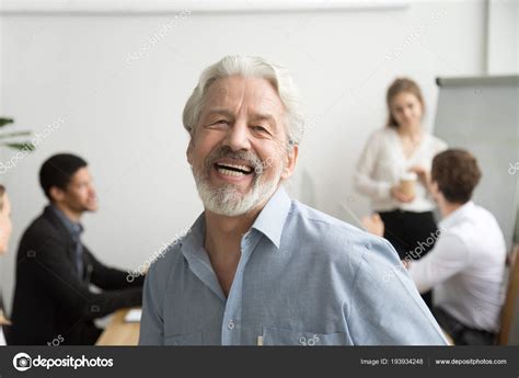 Happy Senior Businessman Laughing Looking At Camera In Office P