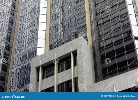 Modern High Rise Building Reflections In Glass Facade Stock Photo