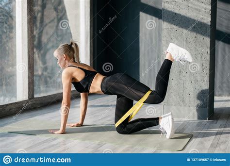 Fitness Woman Doing Leg Exercises With Yellow Fitness Gum Stock Image Image Of White