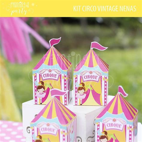 three circus tents sitting on top of a table next to a pink and yellow tent