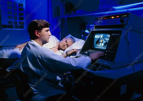 Doctor Performing Echocardiography On Patient Stock Image M4060092