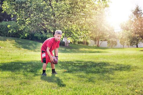 Boy Playing American Football Stock Photo Dissolve