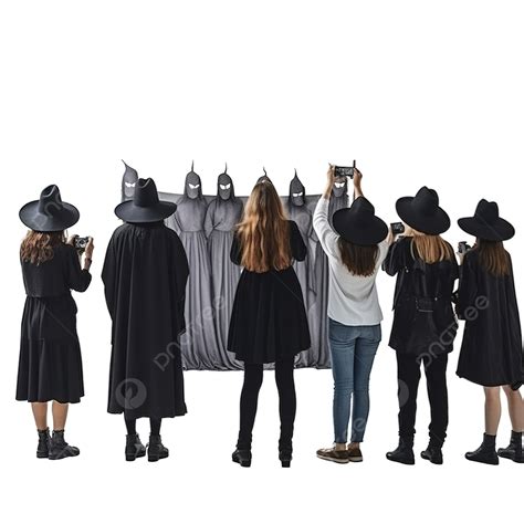 Back View Of Witch Taking Photos Of Spooky Group Of People At Halloween Party Friends Party