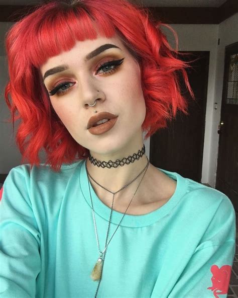 wildfern is totally working this curly red bob this poison and sunset orange combo is