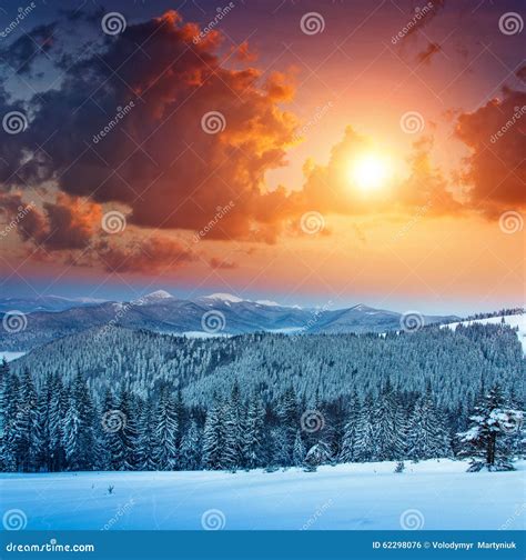 Colorful Winter Sunrise In The Mountains View Of The Fog And Snow Tops