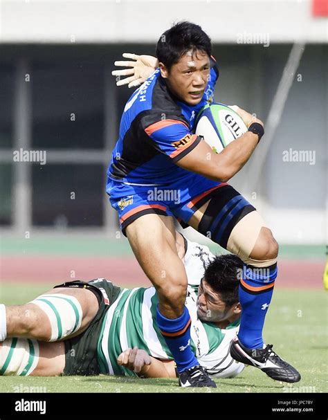 Takuya Yamasawa Breaks A Tackle On His Way To Scoring A Try In