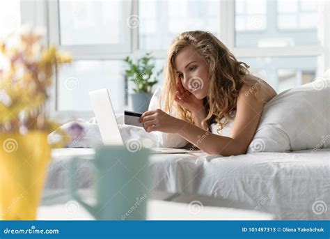 Cheerful Smiling Girl Using Gadget In Bedding Stock Image Image Of