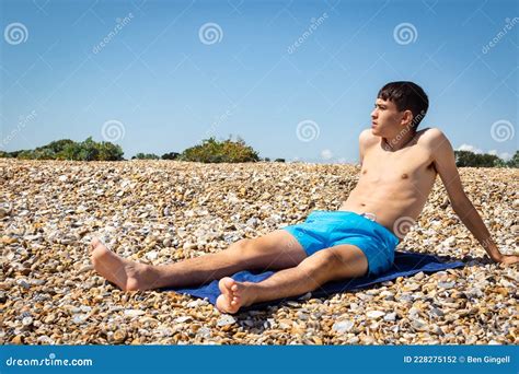 Sunbathing On A Stoney Beach Stock Photo Image Of Relax Shirtless
