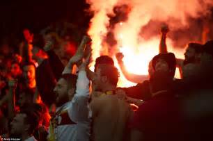 Galatasaray Fans Throw Flares Onto The Pitch During Arsenal Clash As