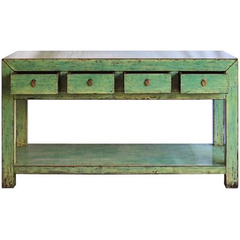Pair of european vintage console tables with chippy, distressed pale green paint finish. Green Console Table at 1stdibs