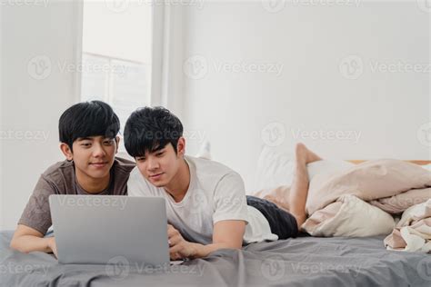 Asian Gay Lgbtq Men Couple Using Computer Laptop At Modern Home Young Asia Lover Male Happy
