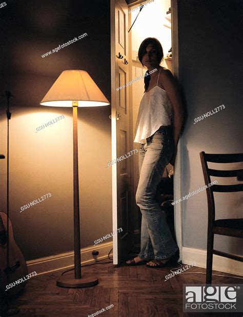 Depressed Woman Leaning Against Wall In Doorway Stock Photo Picture And Rights Managed Image