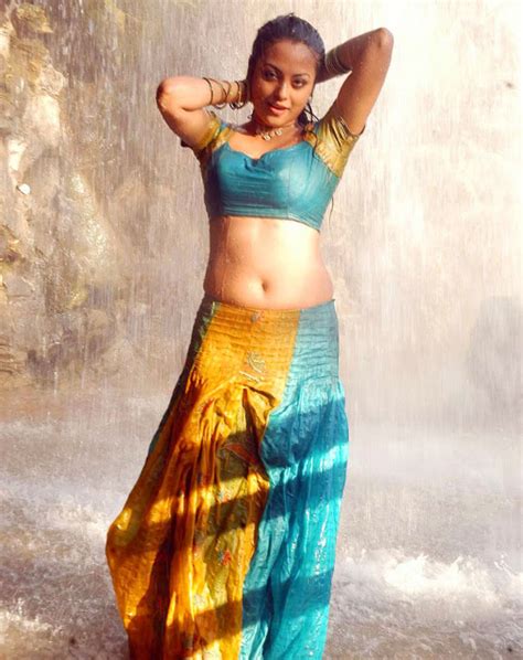 Actress Meenakshi Sexy Navel Cleavage Show In Half Saree Stills From Rajadhi Raja Movie