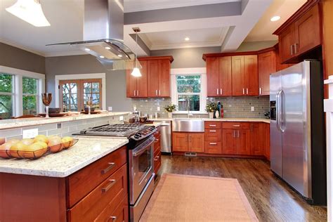 Dark gray kitchen cabinets also match the cabinets on the island and complement the look on the kitchen. Natural American Cherry Shaker - Pius Kitchen & Bath