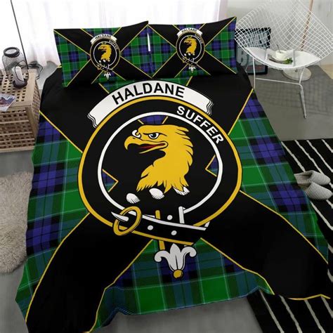 A Bed In A Room With A Black And Green Plaid