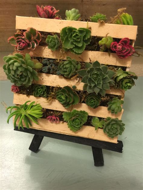 Tiny Pallet Made Out Of Popsicle Sticks Filled Wth Moss And Succulent