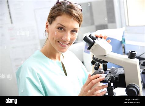 Doctor In Laboratory Looking Through Microscope Stock Photo Alamy