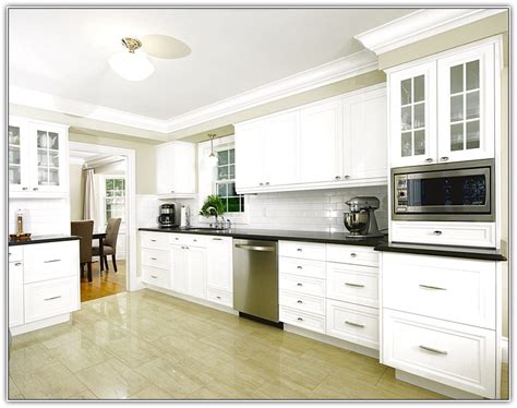 Installing crown molding on cabinets makes them look sophisticated. Kitchen cabinets molding ideas | Hawk Haven