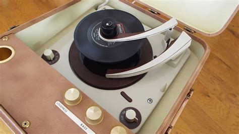 Magnavox Portable Record Player Playing A Stack Of 45 Rpm Records