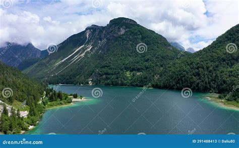View To Julian Alps Mountains Above Predil Lake In Italy With Small