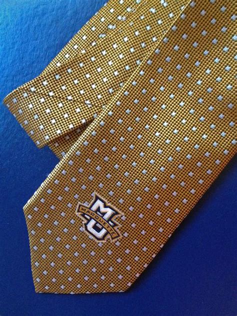 This modern, skinny tie features a woven floral pattern.skinny (under 3 inches).73% cotton, 27% polyester.paisley & gray.imported.dry clean only. My new tie from the Marquette Spirit Shop. I hope ...