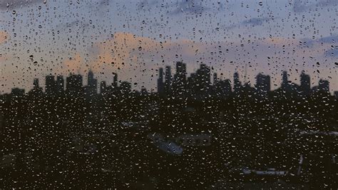 Download Wallpaper 2560x1440 Glass Drops City Rain Widescreen 169