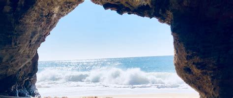 Download Wallpaper 2560x1080 Cave Arch Beach Sea Sand Dual Wide