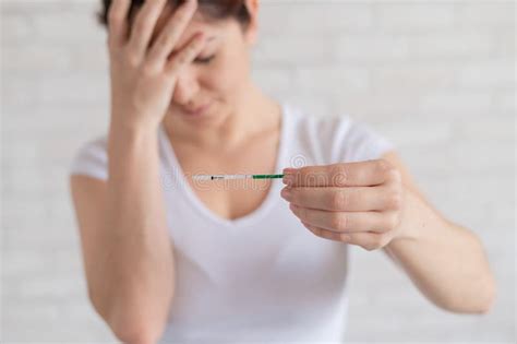 A Frustrated Woman Shows A Negative Pregnancy Test The Concept Of Female Infertility Human