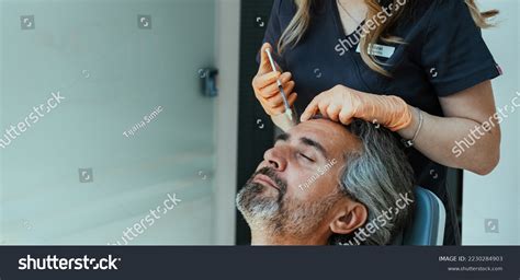 Anonymous Female Beautician Giving Male Patient Stock Photo 2230284903
