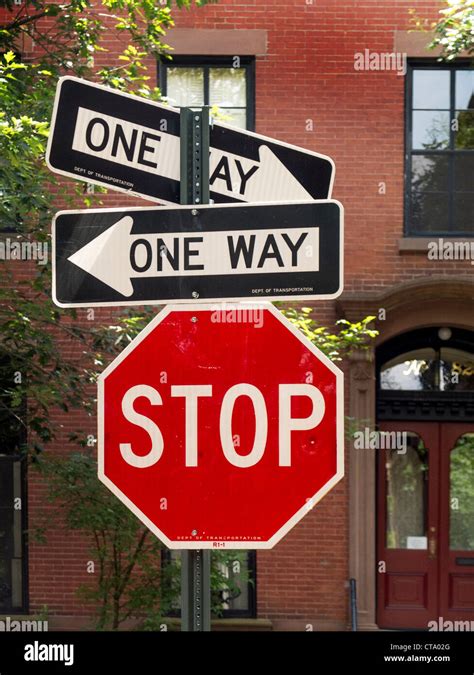 One Way Street Signs Pointing In Opposite Directions Contradict Each