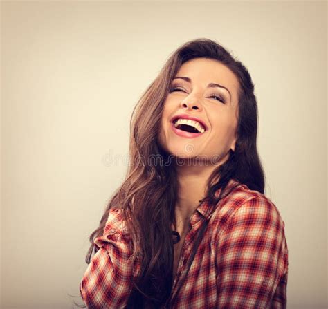 beautiful natural makeup toothy laughing woman with long hair style closeup portrait stock