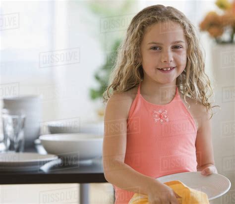 Girl Drying Off Dish Stock Photo Dissolve