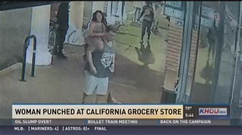 Man Caught On Camera Punching Woman Outside Grocery Store