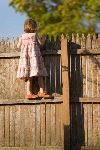 Climbing The Fence Stock Photo Download Image Now Fence Clambering