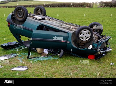 Crashed Car In Field Stock Photo Alamy