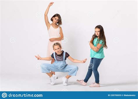 Cool Girls Fooling Around In White Room Making Funny Poses Stock Image Image Of Delighted