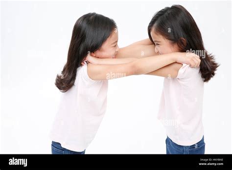 Twin Girls Fighting Stock Photo Alamy
