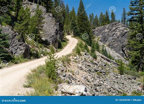 Dirt Gravel Road Going Through The Mountains In Idaho Boundary Stock