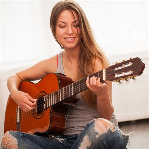 Free Photo Young Beautiful Woman Playing Guitar