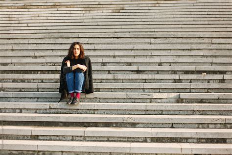 Brunette Woman Sitting On The Stairs By Stocksy Contributor Marija