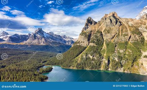 Scenic View Of Glacier Lake With Canadian Rocky Mountains Stock Photo